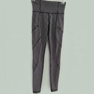 Lululemon Black and White Patterned Leggings with zipper details. Size 2.